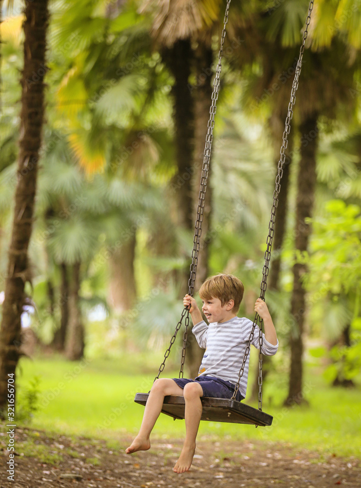 Teen boy on swing