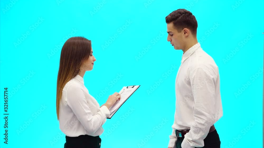 Acquaintance of two business people, on azure blue background. Close up. Copy space. 4K. Acquaintance of two business people, on azure blue background. Close up. Copy space. 4K.