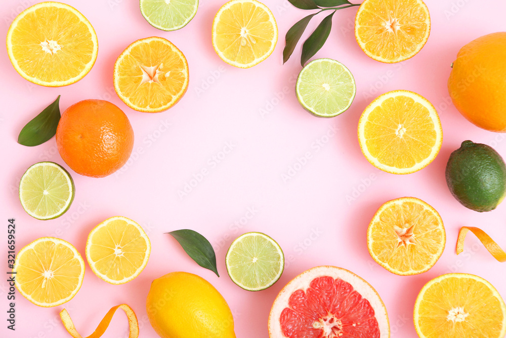 Different citrus and juicy slices on a colored background top view. Place to insert text. Different citrus and juicy slices on a colored background top view. Place to insert text.