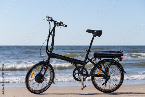 Bicycle on the beach. Bicycle against sea background on sandy shore