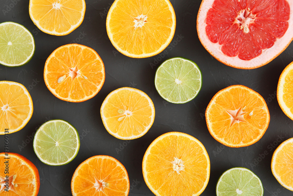 Different citrus and juicy slices on a colored background top view. Place to insert text. Different citrus and juicy slices on a colored background top view. Place to insert text.