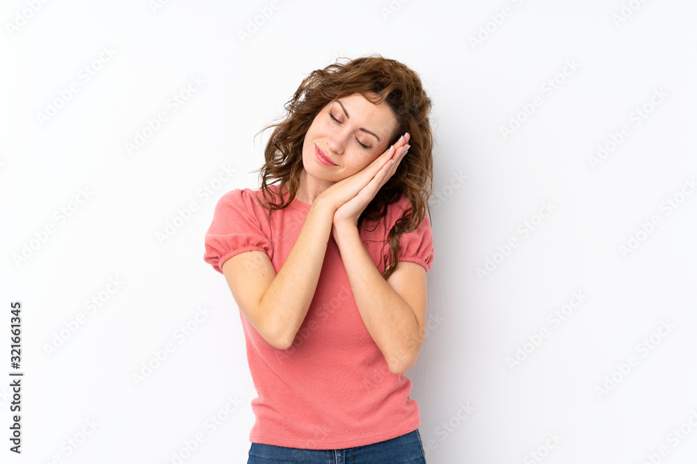 Young pretty woman over isolated background making sleep gesture in dorable expression Young pretty woman over isolated background making sleep gesture in dorable expression