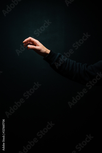 isolated hand reaching, relaxed arm
