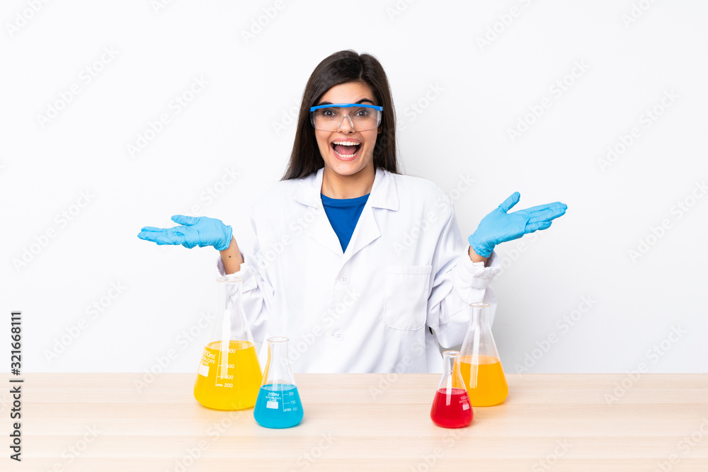 Young scientific woman in a table with shocked facial expression Young scientific woman in a table with shocked facial expression