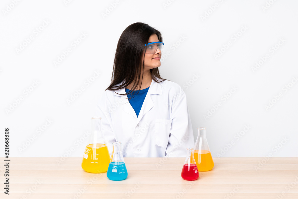 Young scientific woman in a table in lateral position Young scientific woman in a table in lateral position