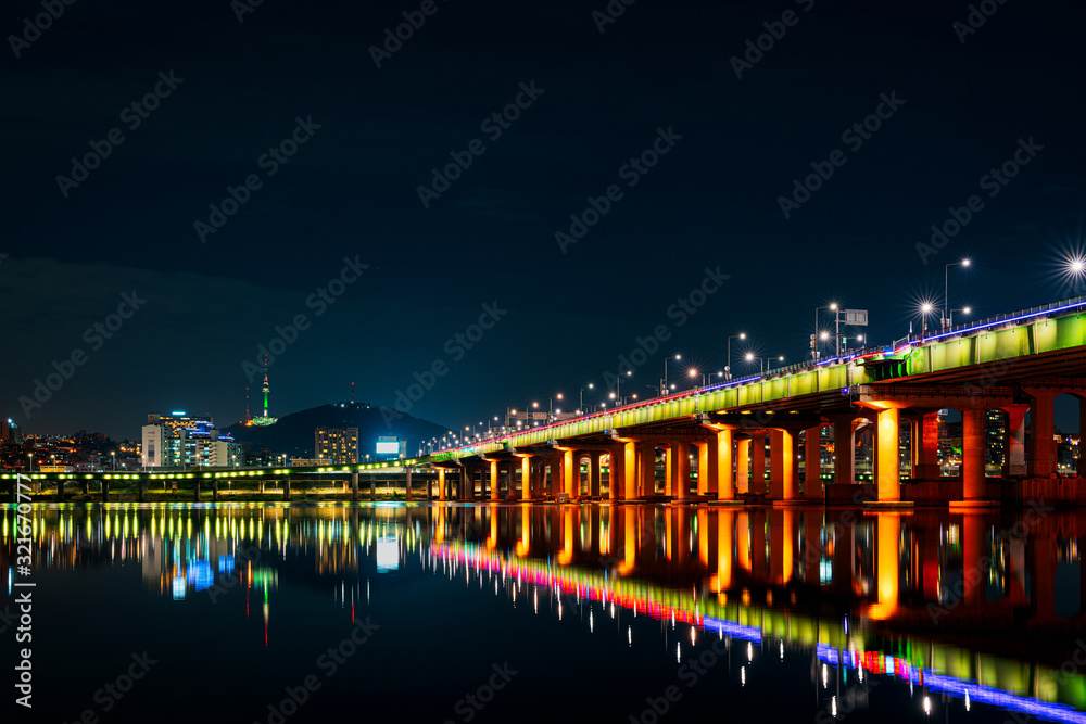 Seoul cityscape bridges, buildings and lights at night along the Han River