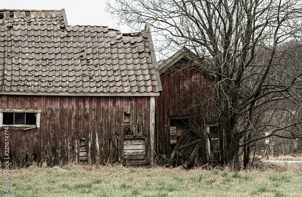 Abandoned farm buildings falling apart. Abandoned farm buildings falling apart.