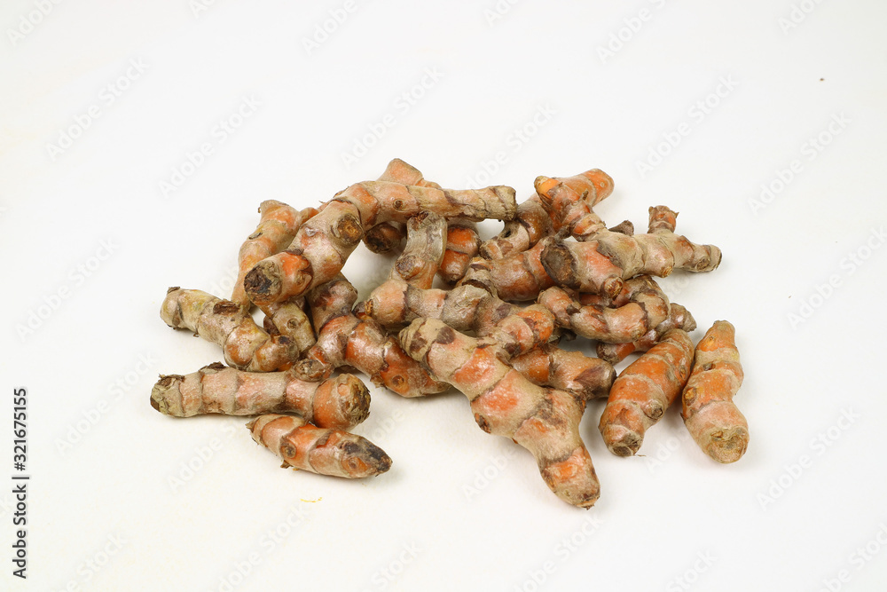 Obraz premium Turmeric root on a white background is used as a tonic for the body and food ingredients.