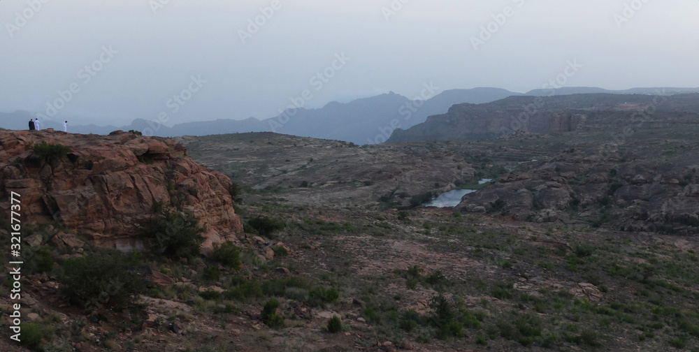 Two Saudi Men contemplating the landscape in Al Habala, Abha, Saudi Arabia