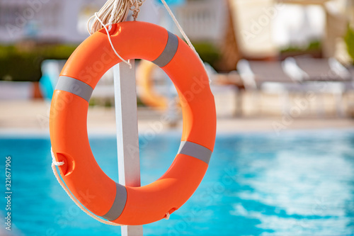 life buoy close-up on pool background with blurry background