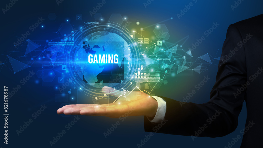 Elegant hand holding GAMING inscription, digital technology concept Elegant hand holding GAMING inscription, digital technology concept