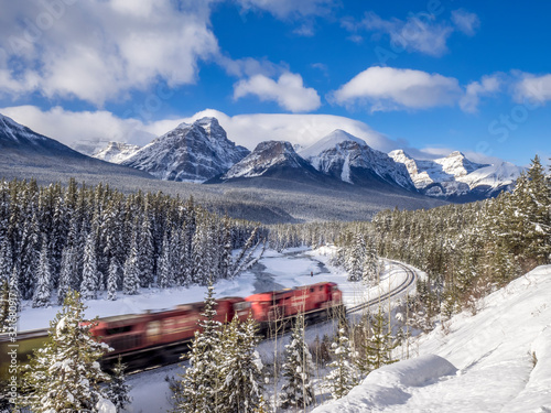 Train on Morant's Curve January in Banff National Park, Alberta, Canada. Morant's Curve is a scenic spot 4 kilometers east of Lake Louise on the old Highway. photo