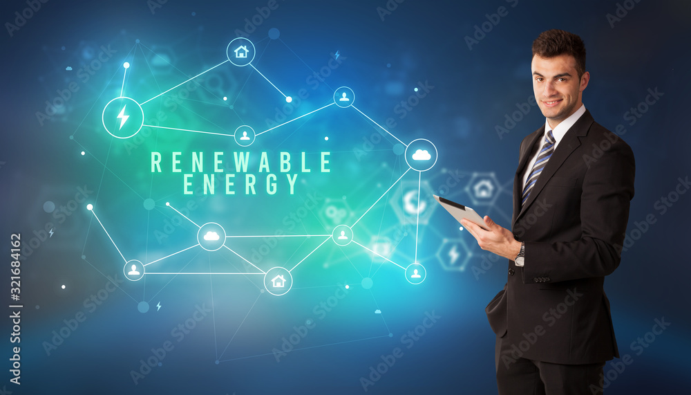 Businessman in front of cloud service icons with RENEWABLE ENERGY inscription, modern technology concept Businessman in front of cloud service icons with RENEWABLE ENERGY inscription, modern technology concept