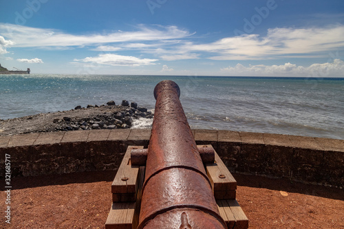 Old cannon at the waterfront of Saint Denis on Reuinion island