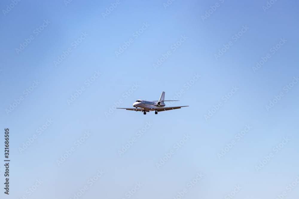 Executive jet is arriving at the airport. Travel by air, transportation. Executive jet is arriving at the airport. Travel by air, transportation.