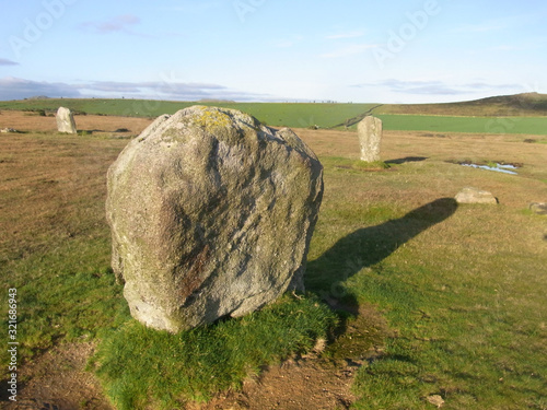 Trippet Stone Circle, Bodmin,Cornwall, UK. 2014/4/25. Bodmin pony or is it a Unicorn by a standing stone part of Trippet Stone Circle, near Blisland, Bodmin Moor. Bronze age with a diameter of 104.6 f photo