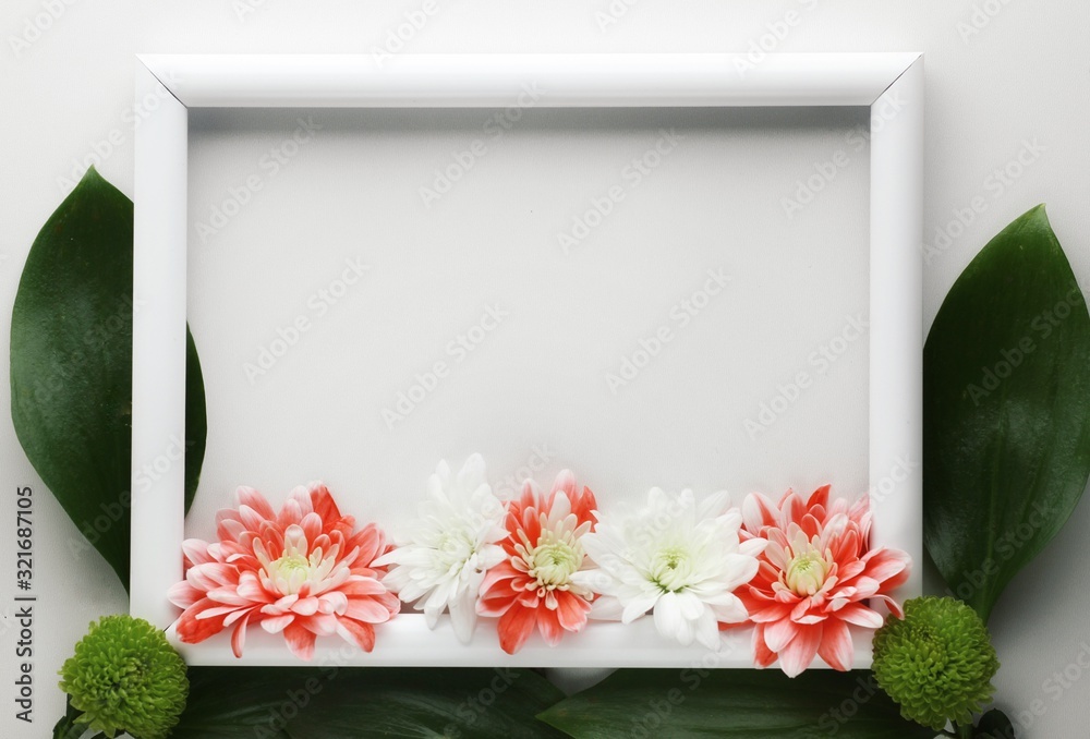 Beautiful spring flowers bouquet in frame for greetings isolated on white