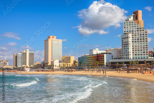 Mediterranean Sea coastal area in Tel Aviv, famous tourist and recreation city in Israel  Sunny day on central public beaches. New embankment along the beach   © Alexey Protasov