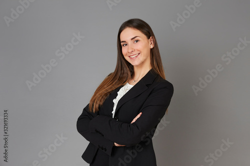 young businesswoman posing instudio background