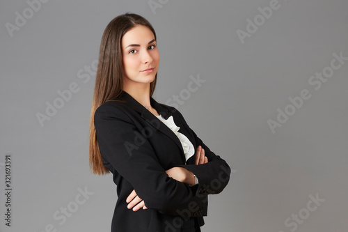 young businesswoman posing instudio background photo