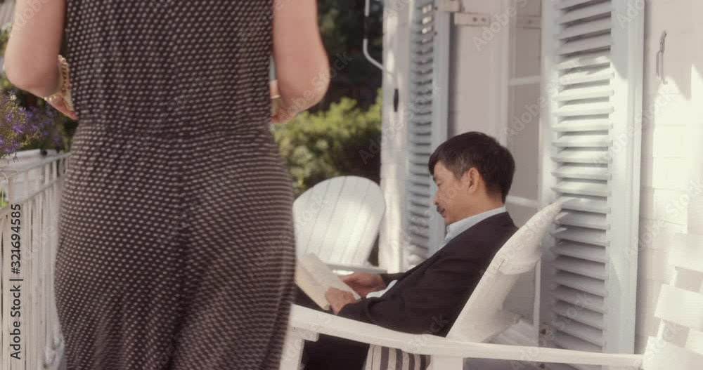 PAN WS Senior Couple Relaxing on a Terrace on a Hot Summer Day. Shot in R3D (6K RED RAW) PAN WS Senior Couple Relaxing on a Terrace on a Hot Summer Day. Shot in R3D (6K RED RAW)