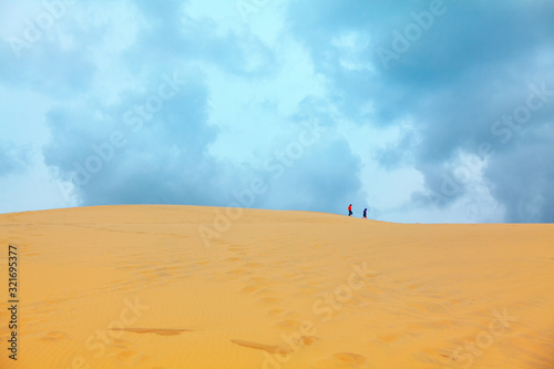 strangers on the top of sandy duna