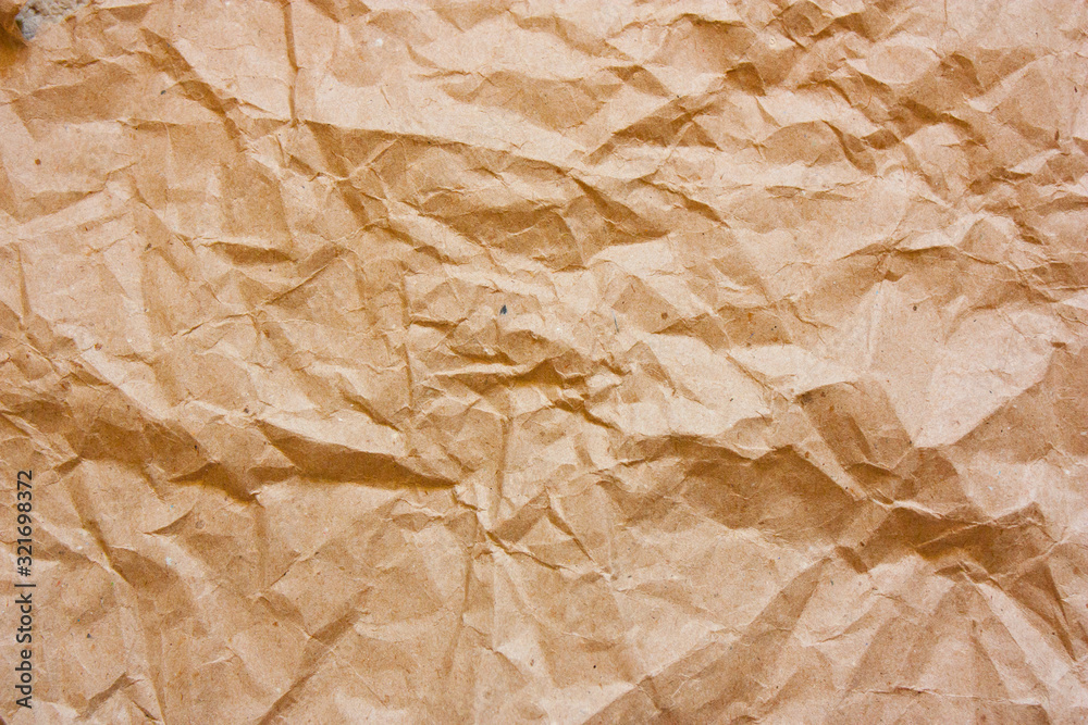 Obraz premium Brown crumpled paper texture. Kraft paper background.