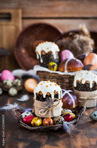 Holiday Easter cakes, hot cross buns and colorful painted eggs © kate_smirnova