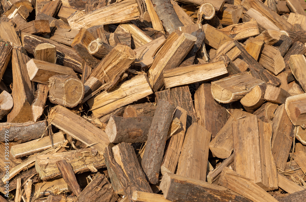 Pile of firewood on a heap. Coniferous stacks of firewood Pile of firewood on a heap. Coniferous stacks of firewood