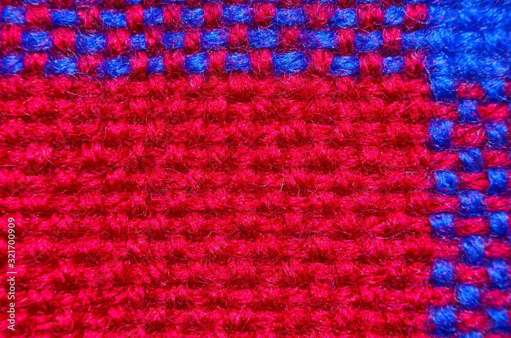 Plaid material. Red and blue clothes background close up macro shot Plaid material. Red and blue clothes background close up macro shot