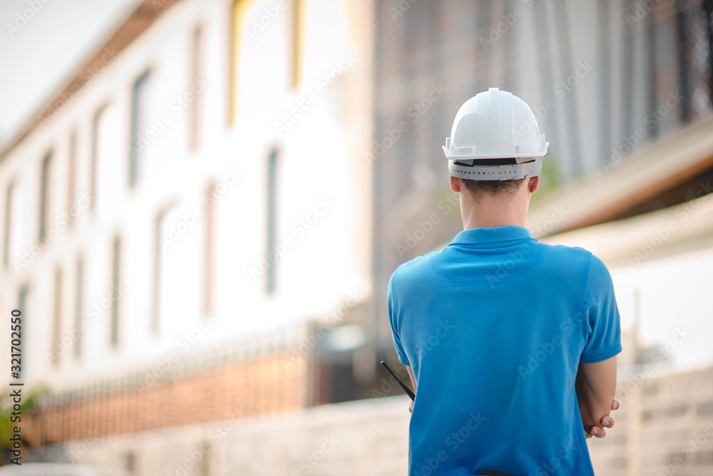 Surveyor engineers at the outdoor construction site during the survey