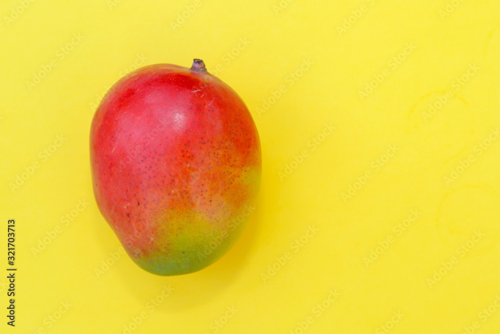 Tropical fruit mango on yellow background. Tropical fruit mango on yellow background.