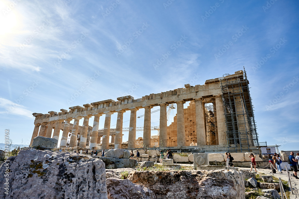 ATHENS, GREECE - 2019 May 18: Tourists in ancient ruins Parthenon Temple in a summer day in Acropolis Greece, Athens
