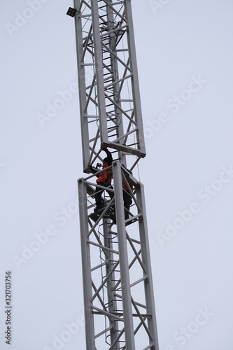 Man at work building tower crane