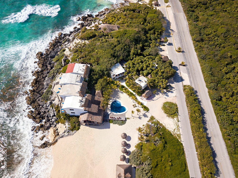 Aerial view of a heart-shaped pool on the beach
