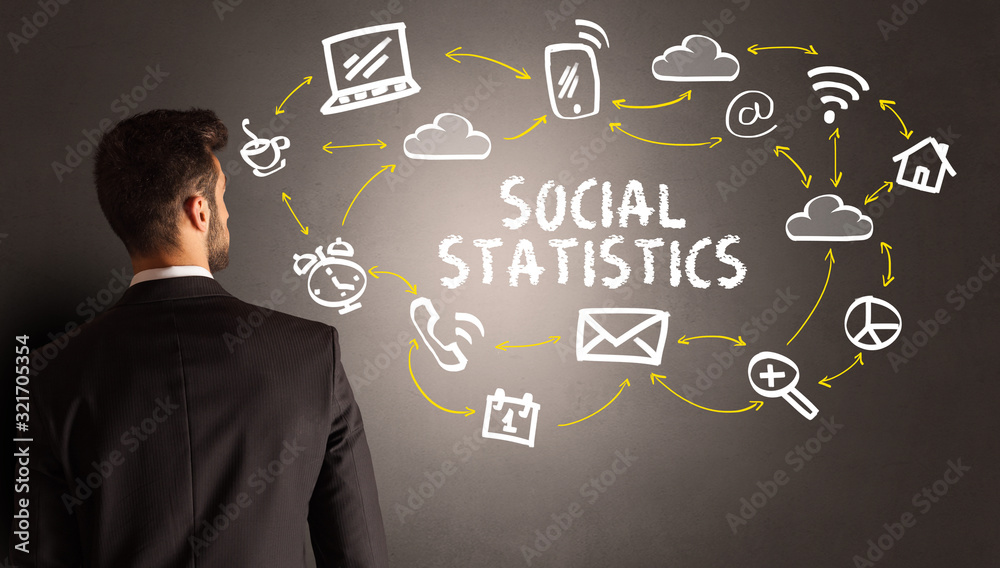 businessman drawing social media icons with SOCIAL STATISTICS inscription, new media concept