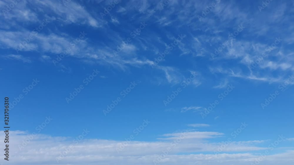 white clouds disappear in the hot sun on blue sky. Time-lapse motion clouds, blue sky background and sun white clouds disappear in the hot sun on blue sky. Time-lapse motion clouds, blue sky background and sun
