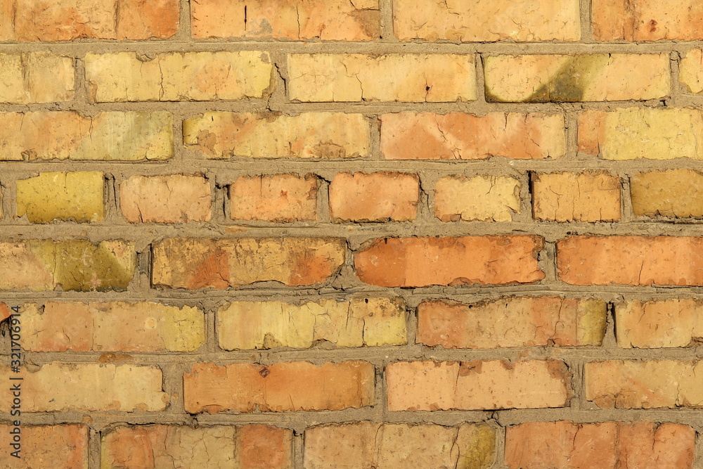 Obraz premium Retro brick wall old golden color texture, great design for any purposes.
