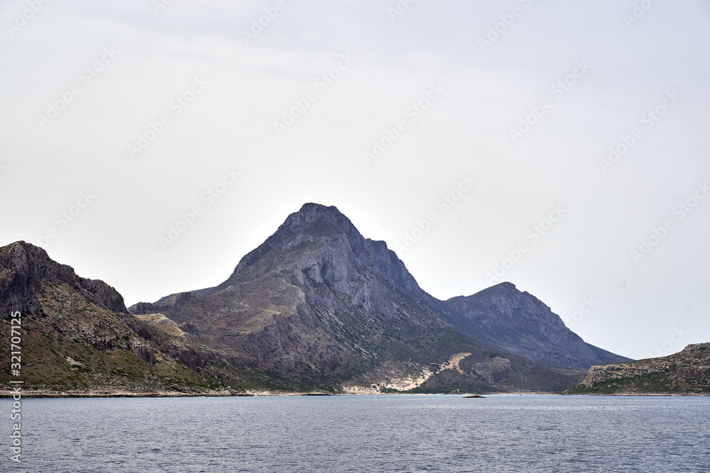 Mountains seen from way to Balos beach on a lagoon and coast of Crete Island, Greece