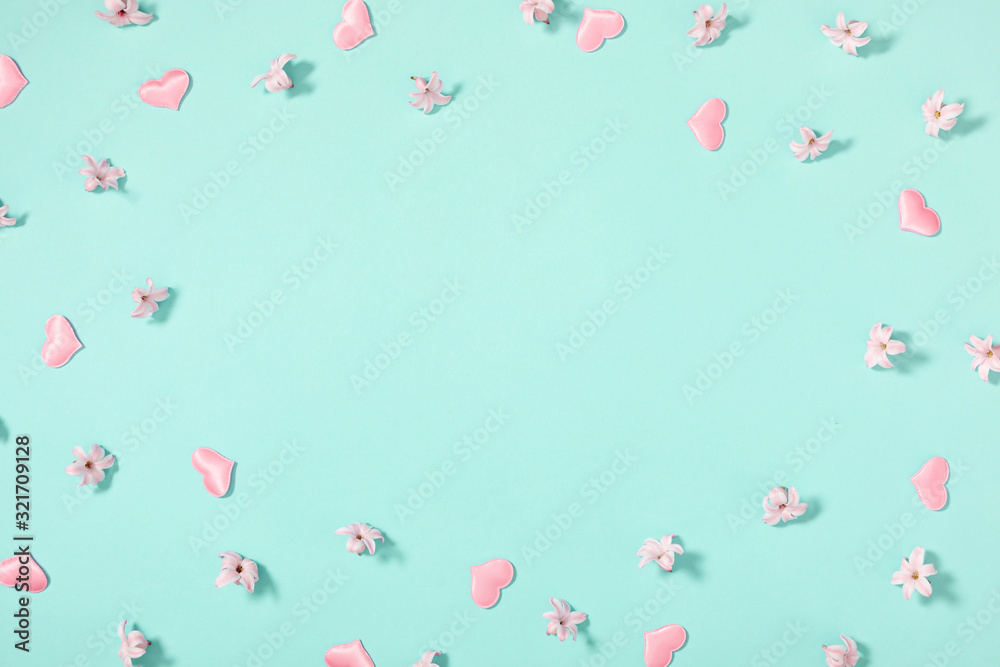 Beautiful flowers composition. Pink flowers on pastel mint background. Valentines Day, Easter, Birthday, Happy Women's Day, Mother's day. Flat lay, top view, copy space