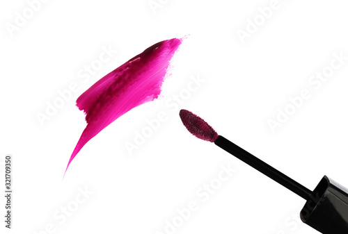 Glossy smear of lipstick with applicator.Isolated on white.Beautiful berry color.