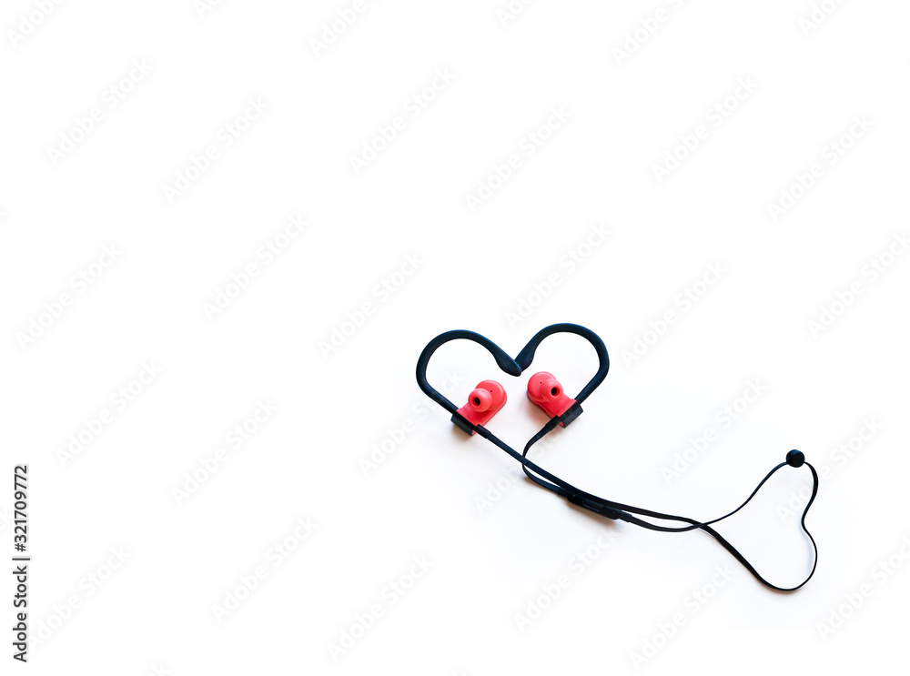 sports headphones in the shape of a heart on a white background. Special Valentine's Day. sports headphones in the shape of a heart on a white background. Special Valentine's Day.
