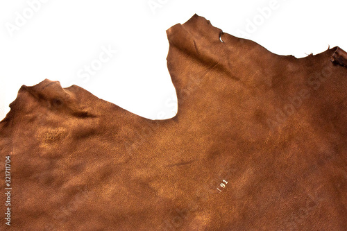 Piece of natural brown leather isolated on white background. Fine Leather Crafting, Handmade Leather handcrafted