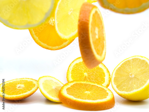 Set of ripe lemon and orange fruits isolated on white background.