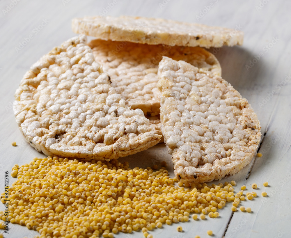 millet bread and millet seeds on a white table millet bread and millet seeds on a white table