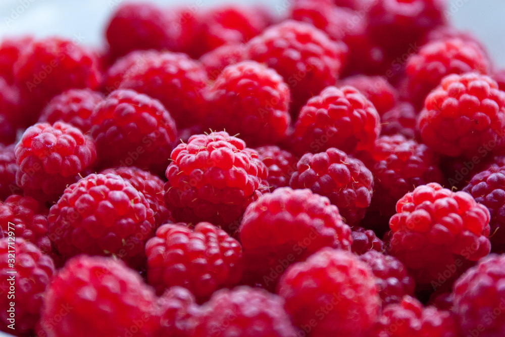 Fresh and sweet red raspberries background