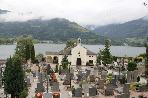 church and cemetery over mountain lake