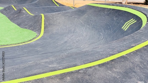 A concrete pump track for skates and bikes.