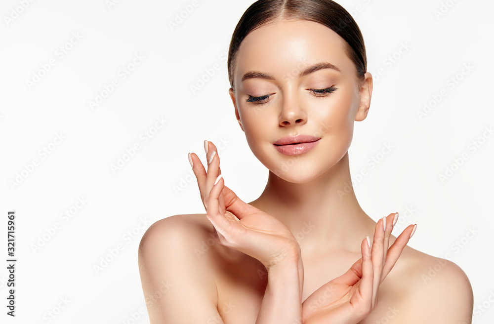 Beautiful young woman with clean fresh skin touching her face . Girl facial treatment . Cosmetology , beauty and spa . Female model, care concept Beautiful young woman with clean fresh skin touching her face . Girl facial treatment . Cosmetology , beauty and spa . Female model, care concept