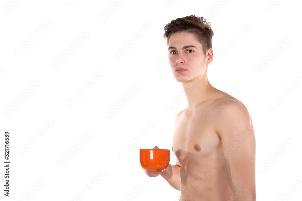 Fototapeta premium Morning. White background. Young attractive guy.